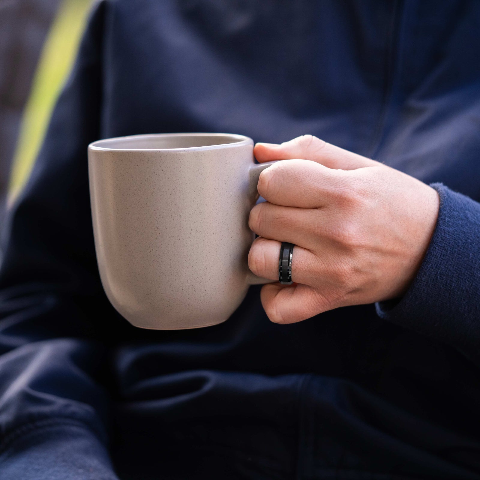 The Storm worn while holding a coffee mug